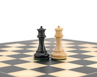 Highclere Series Ebony Staunton black and white chess kings on chessboard